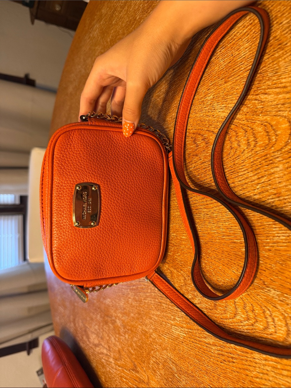 Michael Kors Orange Pebble Leather Mini Crossbody with Gold Plate